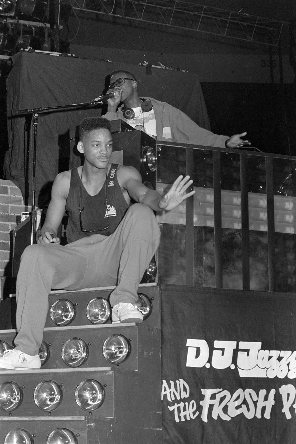 DJ Jazzy Jeff & The Fresh Prince perform on stage.