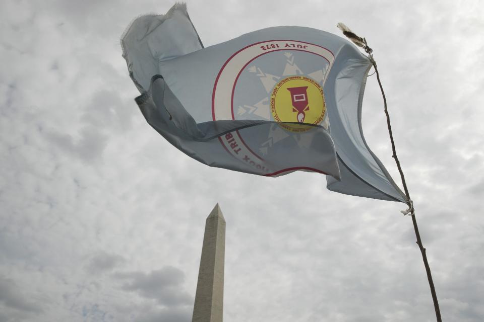 A group protesting the Dakota Access oil pipeline has set up teepees on the National Mall near the Washington Monument in Washington, Tuesday, March 7, 2017. A federal judge declined to temporarily stop construction of the final section of the disputed Dakota Access oil pipeline, clearing the way for oil to flow as soon as next week. (AP Photo/Andrew Harnik)