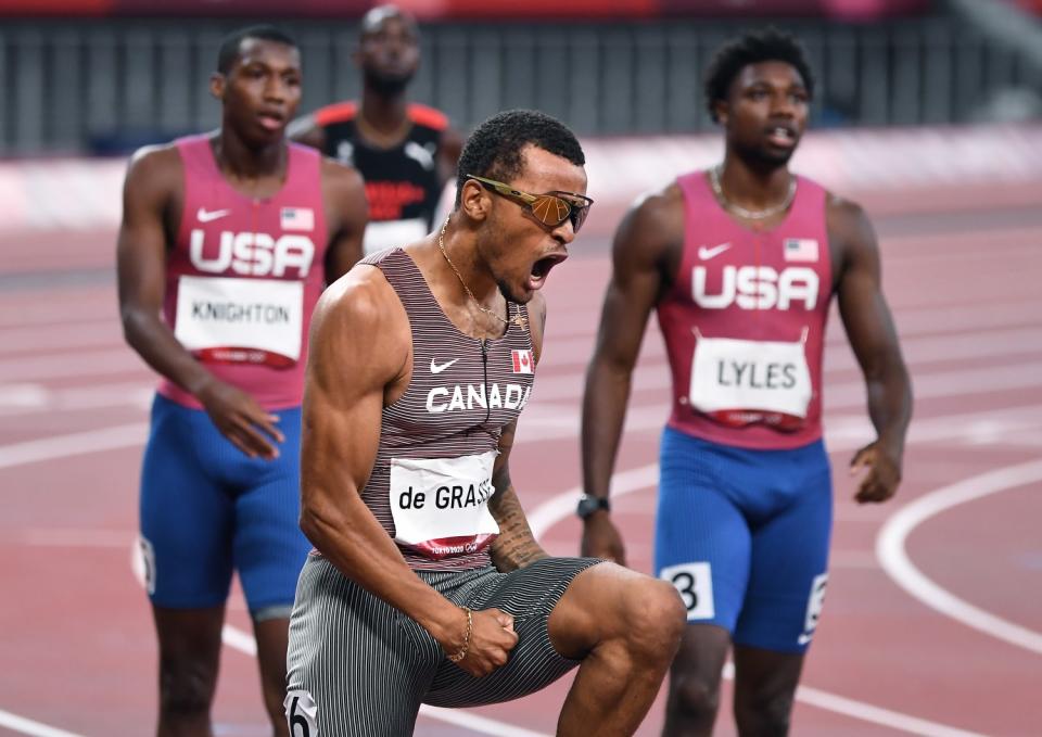 Canada's Andre de Grasse celebrates the gold medal in the 200m final.