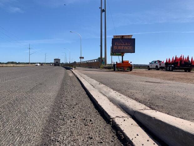 The old asphalt at the approaches to the Hillsborough Bridge was milled in two days. The Department of Transportation says it would likely have taken twice that time if it were done during the day. (Shane Ross/CBC - image credit)