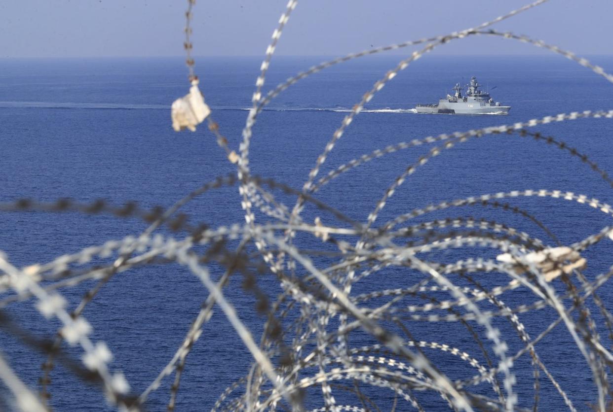 A U.N. navy vessel seen through barbed wire patrols the Mediterranean Sea off the Lebanese coast. <a href="https://newsroom.ap.org/detail/LebanonIsraelBorderDealFallout/ceaec2b4d98b426fa4f13dba93f04cb5/photo?Query=lebanon%20israel%20maritime&mediaType=photo&sortBy=arrivaldatetime:desc&dateRange=Anytime&totalCount=228&currentItemNo=15" rel="nofollow noopener" target="_blank" data-ylk="slk:AP Photo/Mohammed Zaatari;elm:context_link;itc:0;sec:content-canvas" class="link ">AP Photo/Mohammed Zaatari</a>