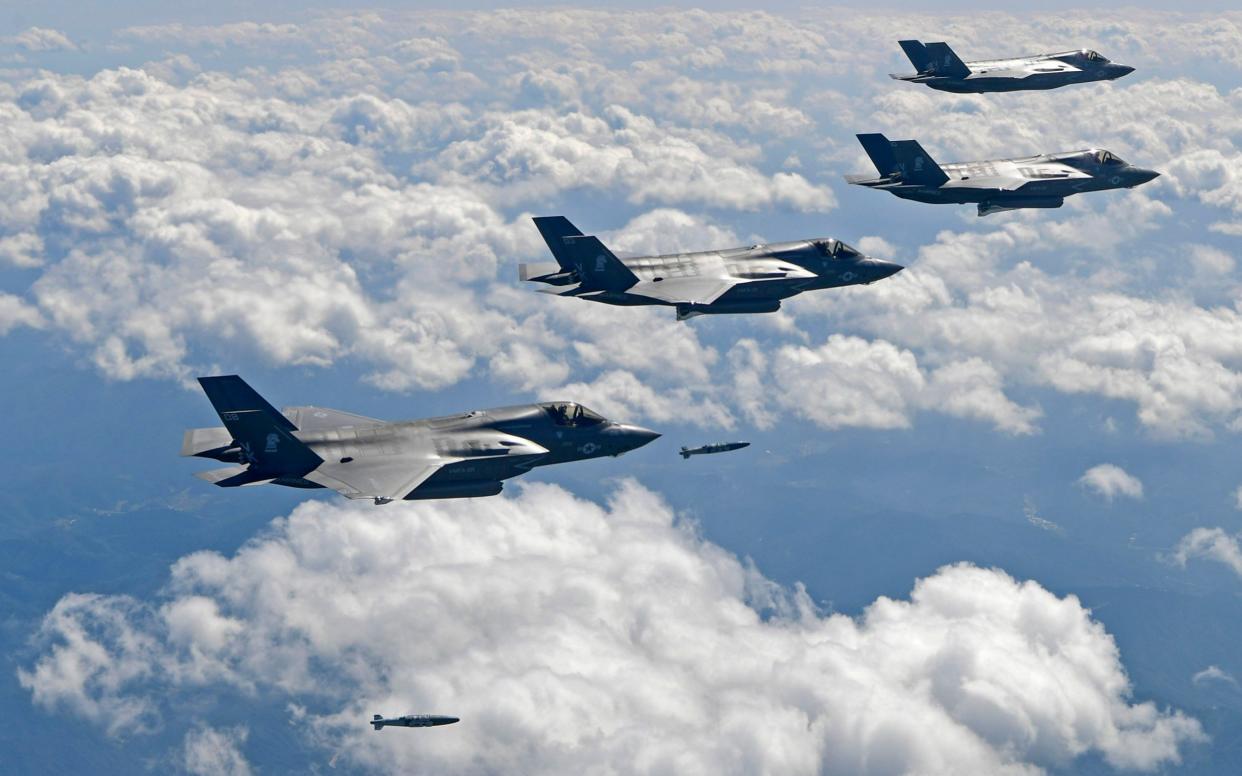 US F-35B stealth jet fighters drop bombs at a shooting range in Gangwon Province, east of Seoul, during a joint military drill  - AFP