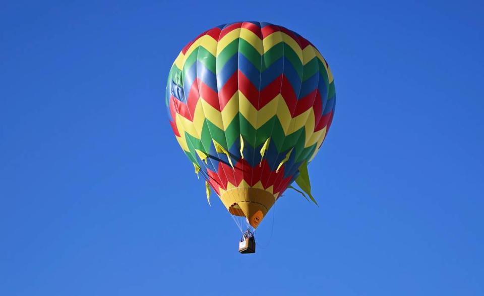 The balloon FreeSpirit piloted by Dana Thornton flies off from River Bluff Regional Park during the Skies the Limit Ceres Balloon Festival in Ceres, Calif., Saturday, June 15, 2024.