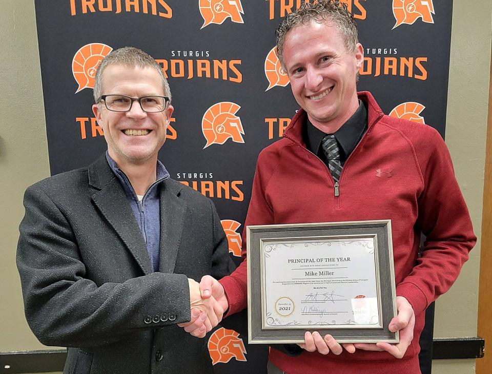 Mike Miller, right, has been named “Principal of the Year” for Michigan Elementary & Middle School Principals Association's Region 4. He is pictured with SPS superintendent Art Ebert.