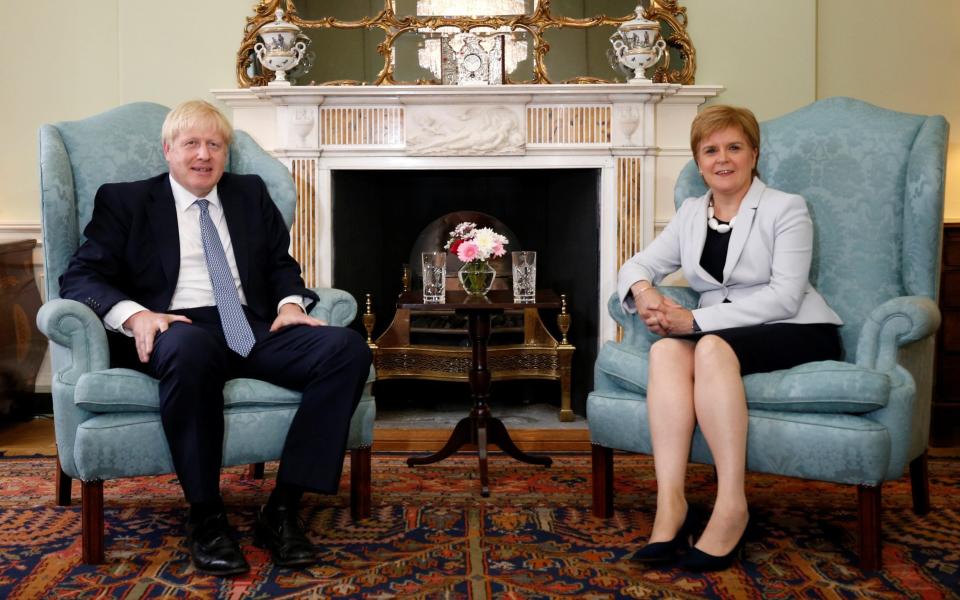 Boris Johnson poses for a photograph with Scotland's First Minister Nicola Sturgeon at Bute House - Duncan McGlynn/Reuters