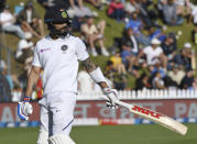 India's Virat Kohli walks, out for 19 to New Zealand's Trent Boult during the first cricket test between India and New Zealand at the Basin Reserve in Wellington, New Zealand, Sunday, Feb. 23, 2020. (AP Photo/Ross Setford)