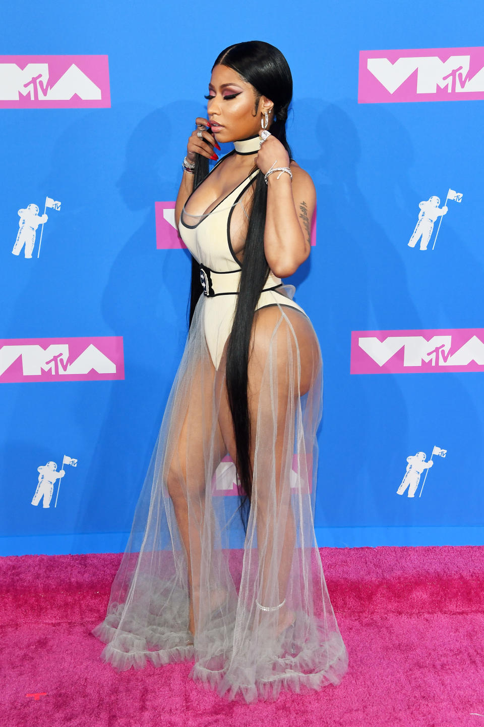 <p>The singer trialled the near-naked trend of 2018 at the VMAs with a hip-grazing leotard and ruffled (totally sheer) skirt by Off-White. <em>[Photo: Getty]</em> </p>