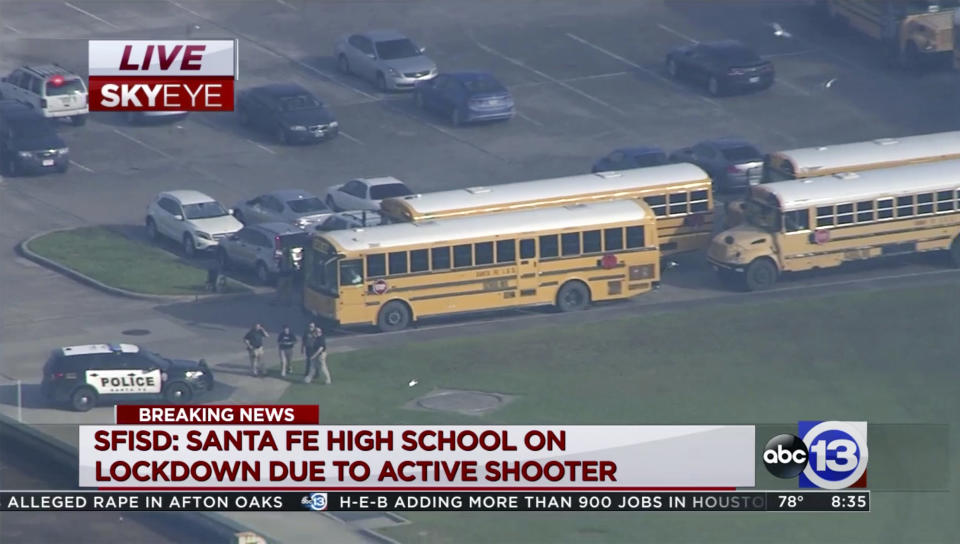 <p>In this image taken from video law enforcement officers respond to a high school near Houston after an active shooter was reported on campus, Friday, May 18, 2018, in Santa Fe, Texas. The Santa Fe school district issued an alert Friday morning saying Santa Fe High School has been placed on lockdown. (Photo: KTRK-TV ABC13 via AP) </p>