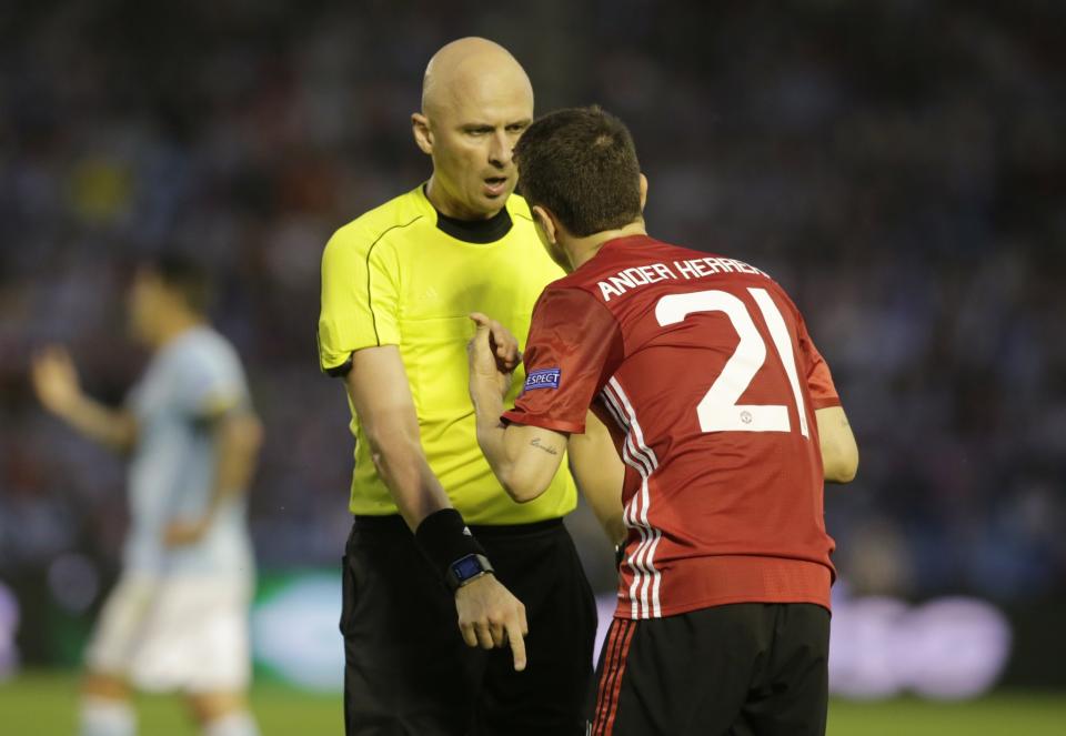 Ander Herrera gets a talking to from the referee