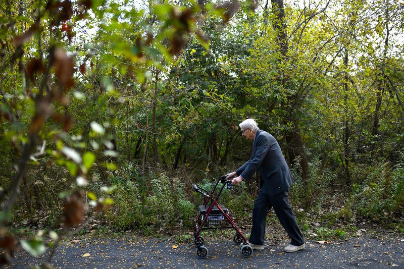 American biologist E.O. Wilson walks along a path in Lexington