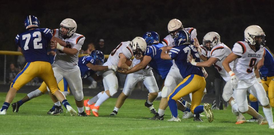 Canton players tackle a Lennox player at Coplan Field on Friday, Sep. 8.