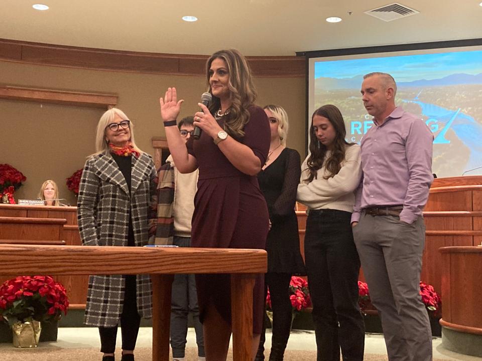 Tenessa Audette, with her family watching, takes the oath of office at the Tuesday, Dec. 6, 2022, Redding City Council meeting.