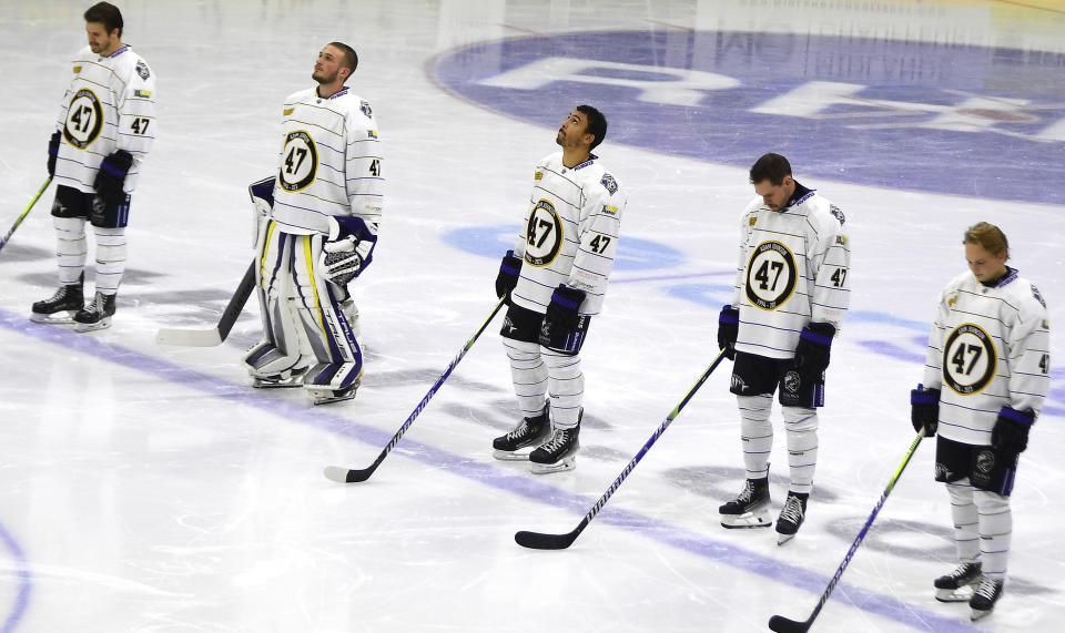 CAPTION CORRECTS PLAYERS' TEAM Manchester Storm players wearing number 47, Adam Johnson's number, pay tribute before the Ice Hockey Adam Johnson memorial game between Nottingham Panthers and Manchester Storm at the Motorpoint Arena, Nottingham, England, Saturday, Nov. 18, 2023. The memorial game is held three weeks after Adam Johnson, 29, suffered a fatal cut to his neck during a game against Sheffield Steelers on Saturday, October 28. (AP Photo/Rui Vieira)