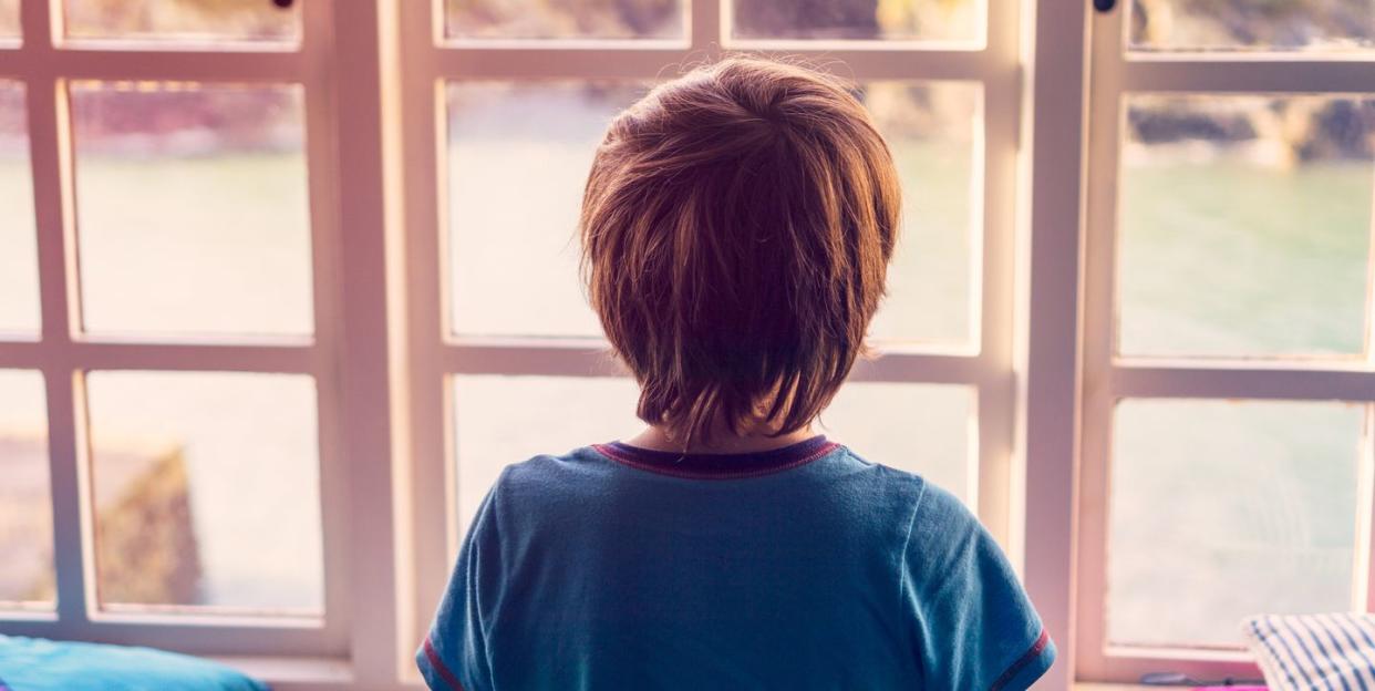 boy looking out of window