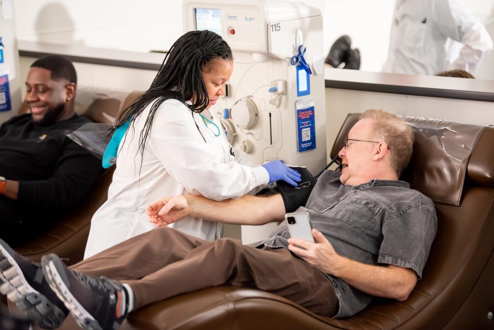 People donate plasma at a BioLife Plasma Services donation center.