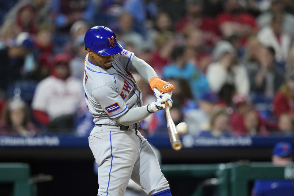 New York Mets' Francisco Lindor hits a home run against Philadelphia Phillies pitcher Gregory Soto during the eighth inning of a baseball game, Friday, Sept. 22, 2023, in Philadelphia. (AP Photo/Matt Slocum)