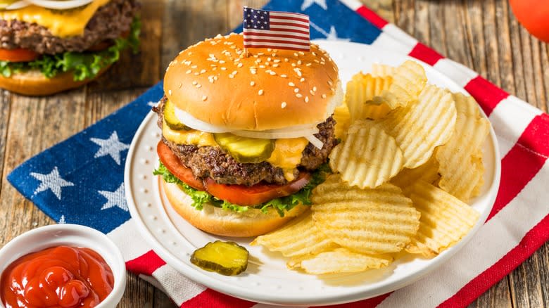 Hamburger on plate with chips