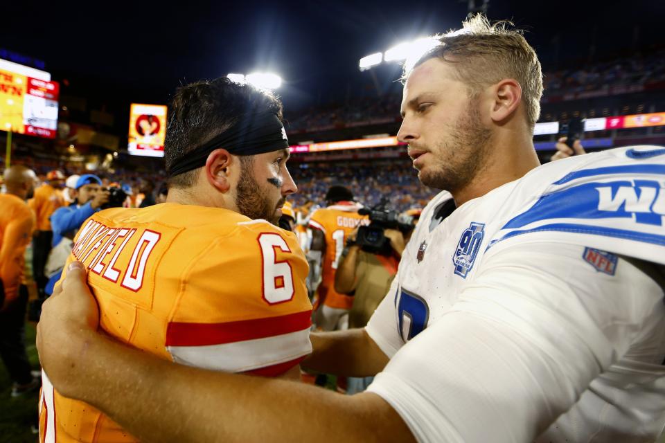 Baker Mayfield of the Tampa Bay Buccaneers and Jared Goff of the Detroit Lions hug after Detroit's 20-6 win at Raymond James Stadium on October 15, 2023, in Tampa, Florida.