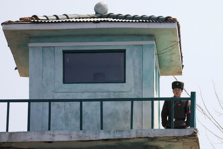 A North Korean soldier looks from a watchtower on the banks of the Yalu River, just north of Sinuiju, North Korea, March 31, 2017. REUTERS/Damir Sagolj