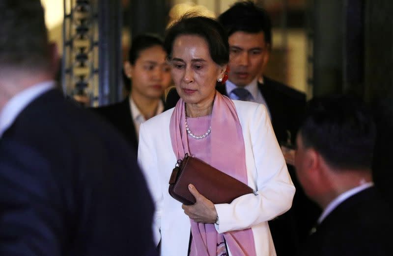 FILE PHOTO: Myanmar's leader Aung San Suu Kyi leaves the International Court of Justice (ICJ), the top United Nations court, after court hearings in a case filed by Gambia against Myanmar alleging genocide against the minority Muslim Rohingya population, i