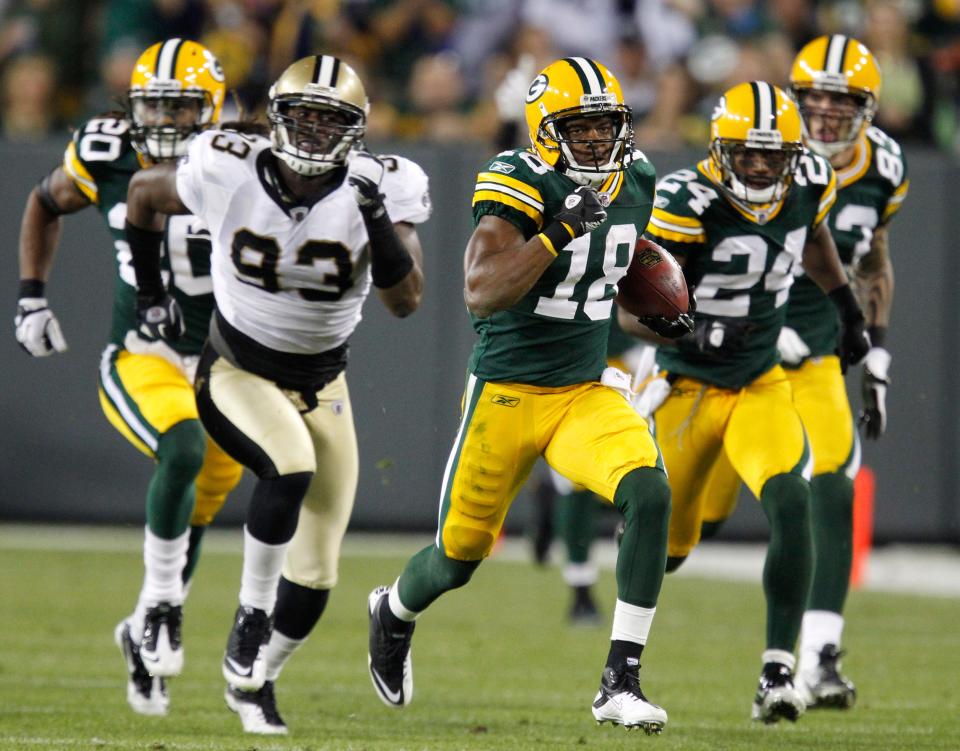 Packers receiver Randall Cobb returns a kick 108 yards for a touchdown against the Saints during the 2011 season opener.