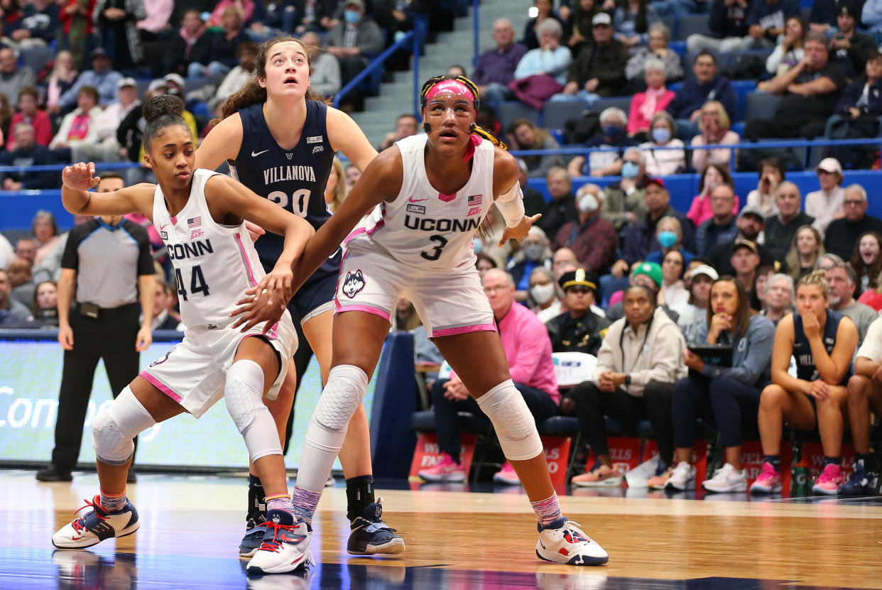 UConn forwards Aubrey Griffin (44) and Aaliyah Edwards (3) block out Villanova forward Maddy Siegrist during a game on Jan. 29, 2023, at XL Center in Hartford, Connecticut. (M. Anthony Nesmith/Icon Sportswire via Getty Images)