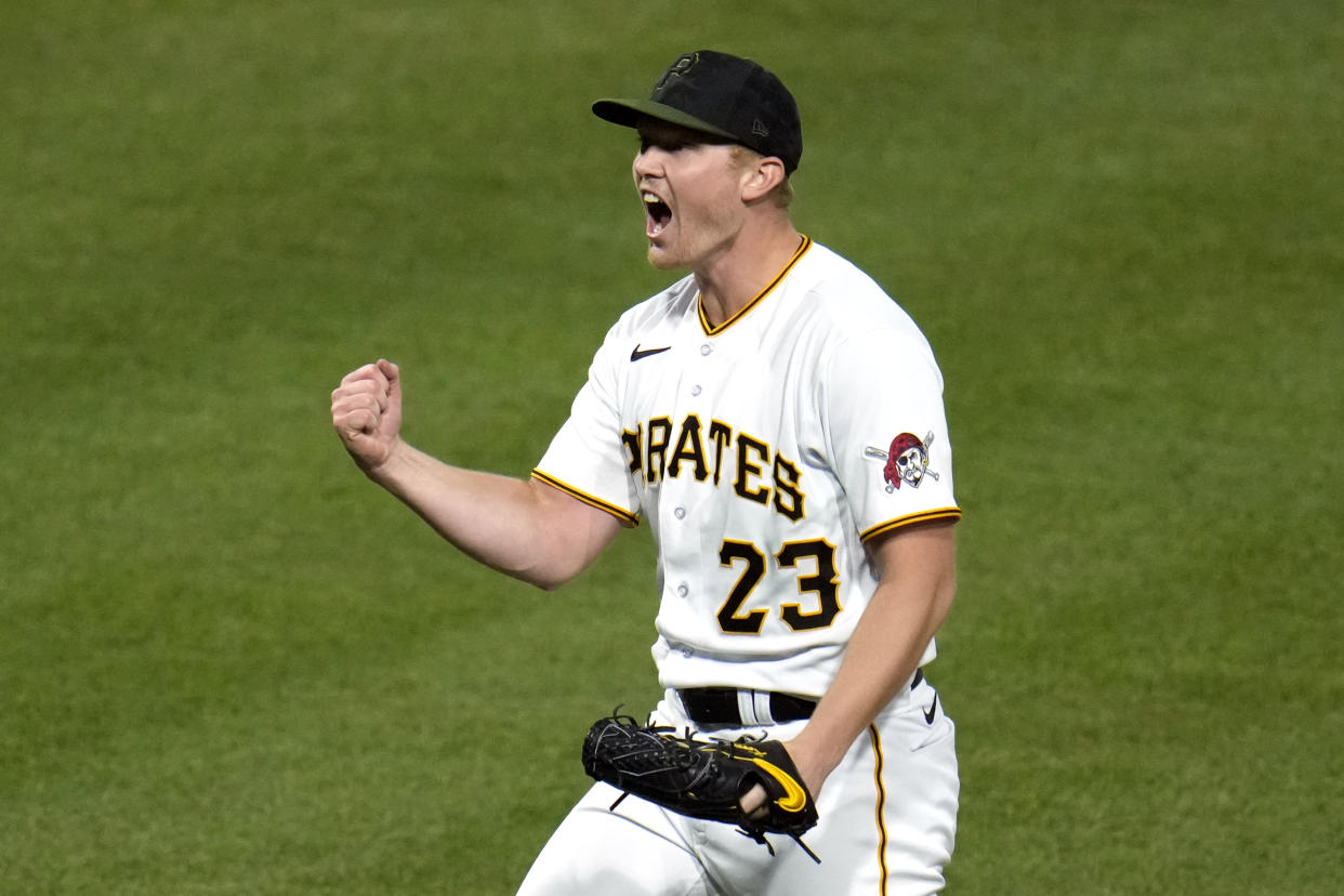 Pittsburgh Pirates starting pitcher Mitch Keller, right, celebrates pitching a complete game shutout with catcher Austin Hedges at the end of a baseball game against the Colorado Rockies in Pittsburgh, Monday, May 8, 2023. The Pirates won 2-0. (AP Photo/Gene J. Puskar)