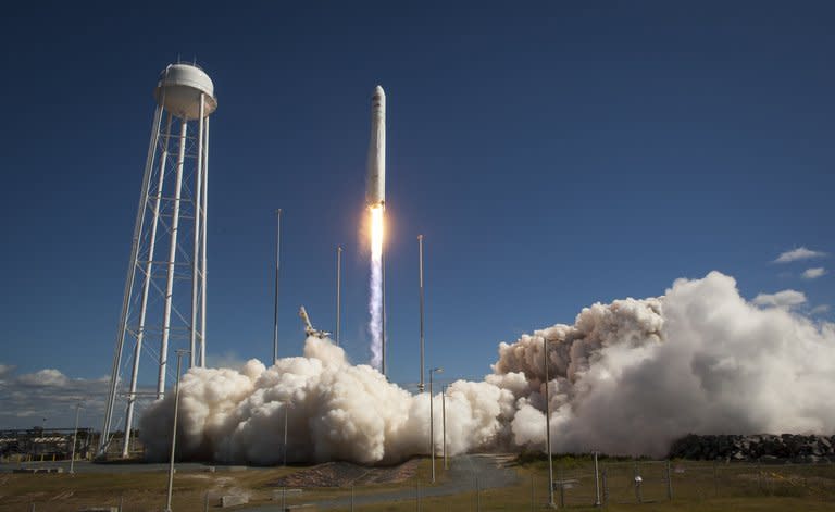 This photo courtesy of NASA shows the Orbital Sciences Corporation Antares rocket, with the Cygnus cargo spacecraft aboard, as it launches from Pad-0A of the Mid-Atlantic Regional Spaceport (MARS), September 18, 2013, NASA Wallops Flight Facility, Virginia