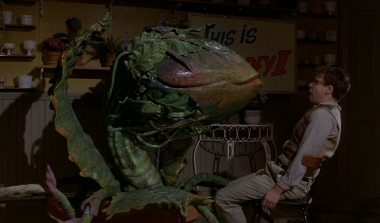 Rick Moranis and the dreaded Audrey II in 1986's 'Little Shop of Horrors' (credit: Warner Bros)