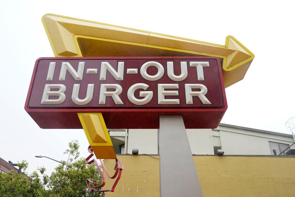 The sign to an In-N-Out restaurant is shown in San Francisco's Fisherman's Wharf, Wednesday, Oct. 20, 2021.