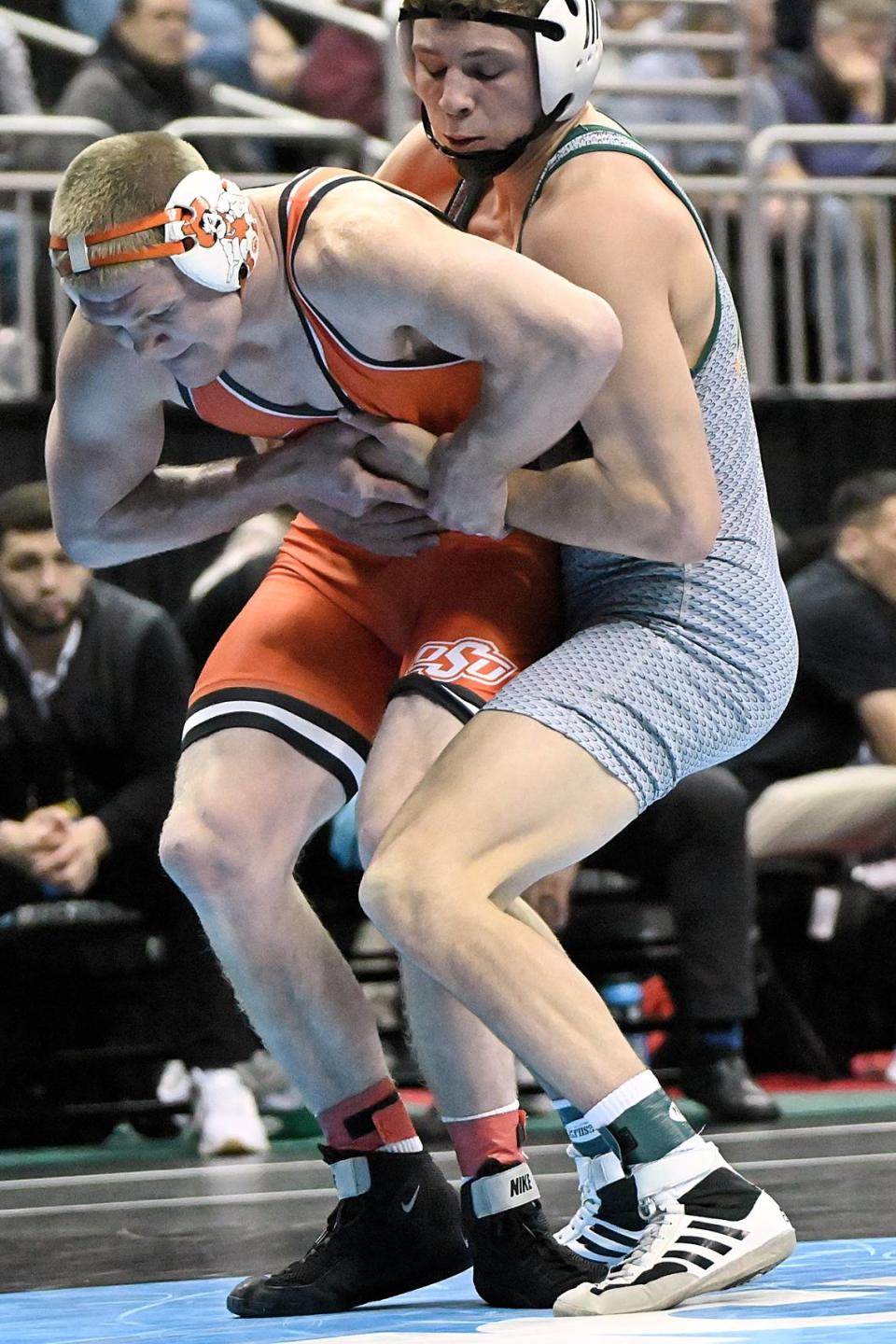 George Mason’s Malachi DuVall, who is a Penns Valley graduate, attempts to keep Oklahoma State’s Dustin Plott from escaping in their 184 pound first round match of the NCAA Championships on Thursday, March 21, 2024 at T-Mobile Center in Kansas City, Mo. Plott beat DuVall, 17-2.