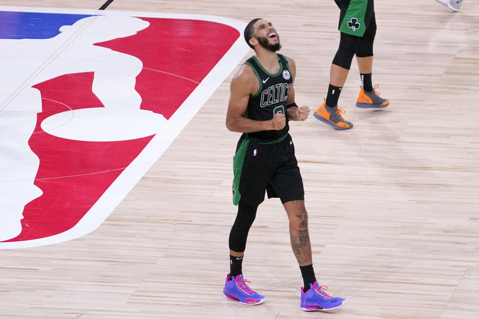 Boston Celtics' Jayson Tatum (0) reacts after his team defeated the Toronto Raptors during an NBA conference semifinal playoff basketball game Friday, Sept. 11, 2020, in Lake Buena Vista, Fla. The Celtics won 92-87. (AP Photo/Mark J. Terrill)