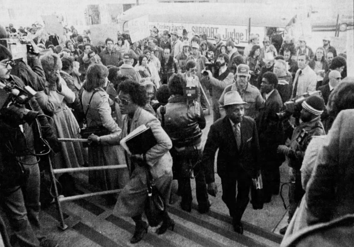 In a Town Talk file photo from 1982, Louis Berry (right) enters the U.S. District Court for the case concerning the "Buckeye 3." The dispute was over whether three girls could change schools in violation of the federal court's desegregation ruling. The case gained world-wide attention.