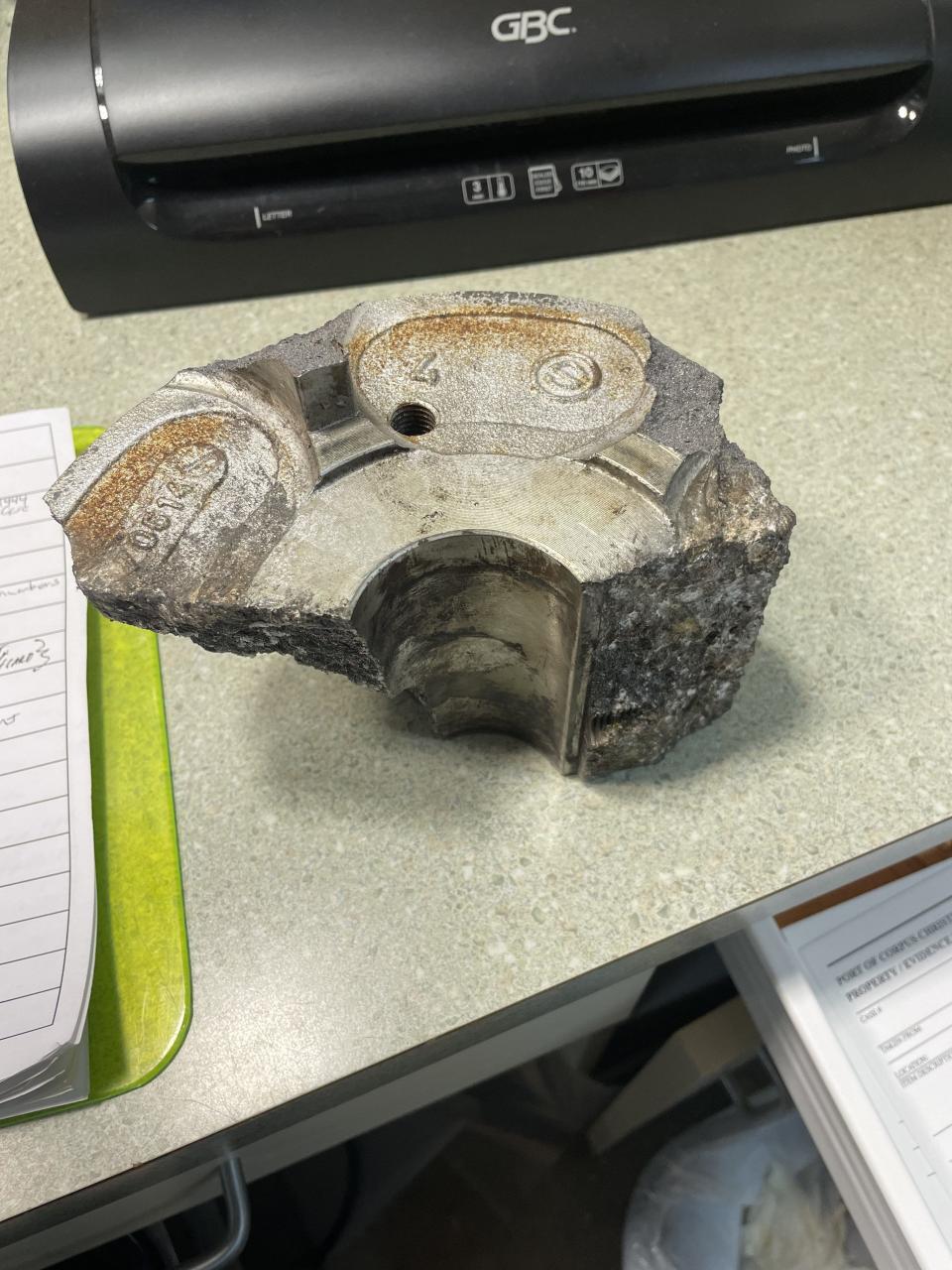 A "large piece of industrial metal" found in a parking lot south of Whataburger Field rests on a table at the Port of Corpus Christi Command Center in Corpus Christi, Texas.