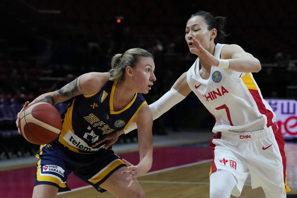 Bosnia and Herzegovina's Matea Tavic attempts to get past China's Yang Liwei during their game at the women's Basketball World Cup in Sydney, Australia, Friday, Sept. 23, 2022. (AP Photo/Mark Baker)