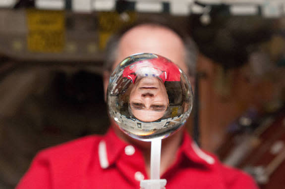 NASA astronaut Kevin Ford plays with a water bubble on the International Space Station in 2013.