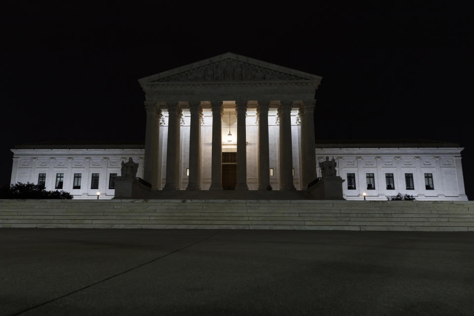 The Supreme Court is seen in Washington, late Tuesday, July 16, 2019. Former U.S. Supreme Court Justice John Paul Stevens died Tuesday in Fort Lauderdale, Fla., after suffering a stroke Monday. He was 99. (AP Photo/Carolyn Kaster)