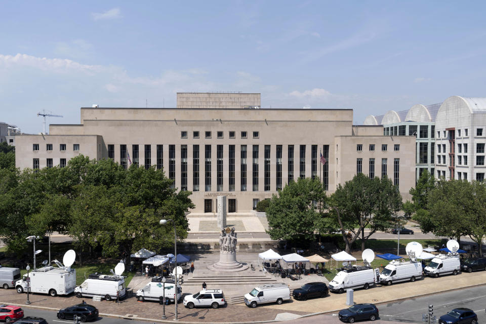 Television news crews set up outside federal court in Washington, on Thursday, July 27, 2023, where a grand jury has been meeting in the probe led by special counsel Jack Smith against former President Donald Trump. (AP Photo/Jose Luis Magana)