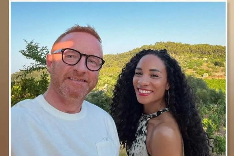 Man and woman smiling in a selfie