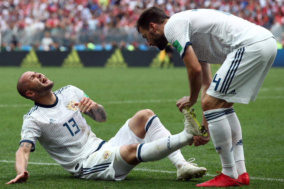 Pain game: Russia’s player feel the strain as the game goes into extra time