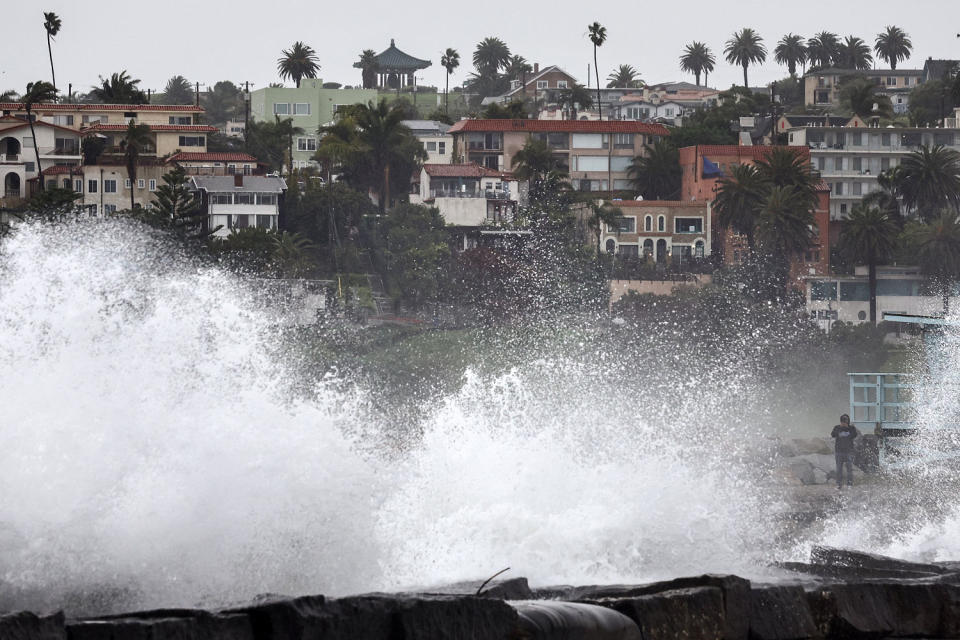 Waves crashing on breakwater rocks at Cabrillo Beach in Los Angeles (Mario Tama / Getty Images)