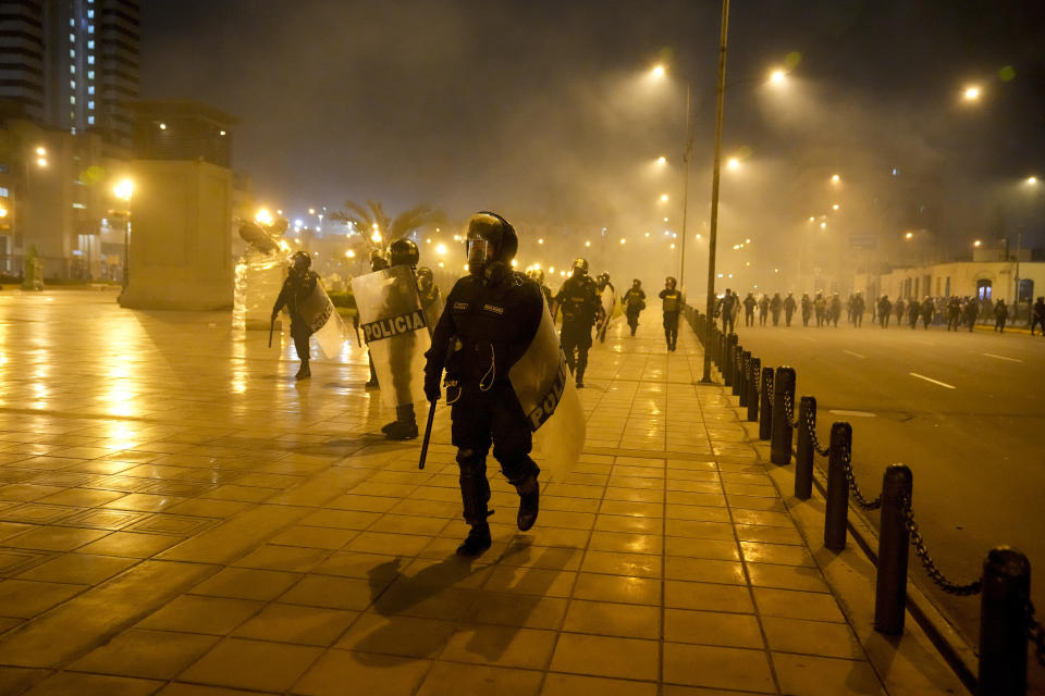 Police clash with anti-government protesters in Lima, Peru, Friday, Jan. 20, 2023. Protesters are seeking the resignation of President Dina Boluarte, the release from prison of ousted President Pedro Castillo and immediate elections. (AP Photo/Martin Mejia)