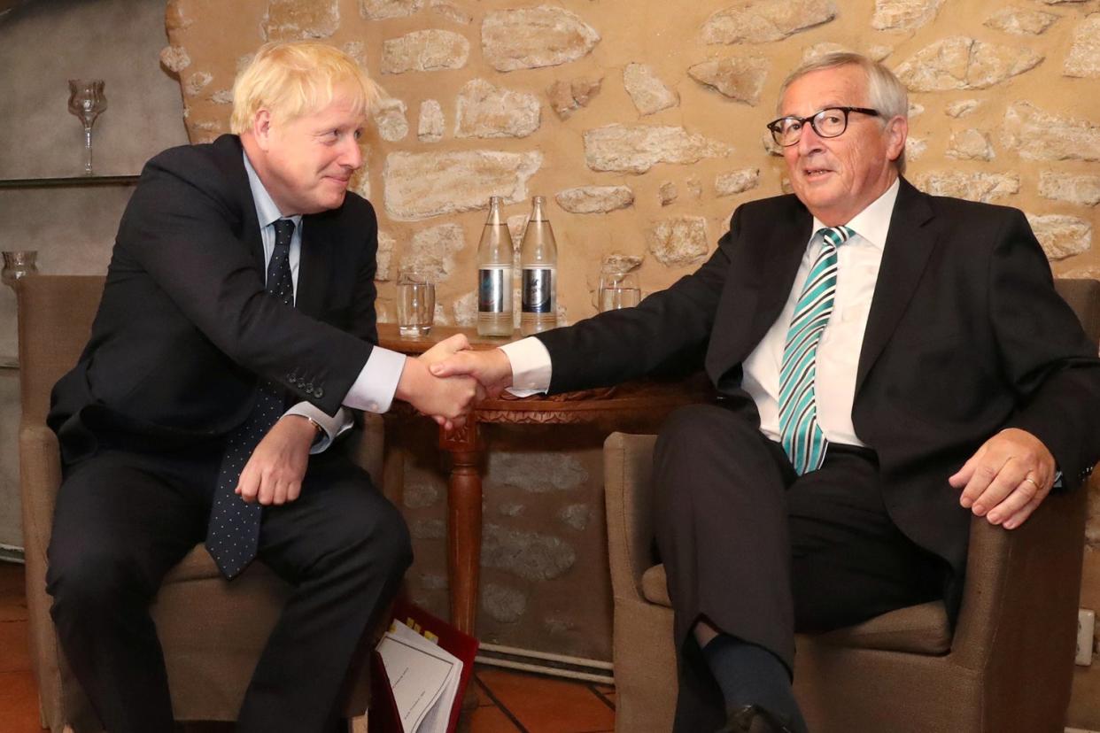 A file image of Boris Johnson and Jean-Claude Juncker as the pair confirmed on Thursday that a Brexit agreement has been reached: Yves Herman/Reuters