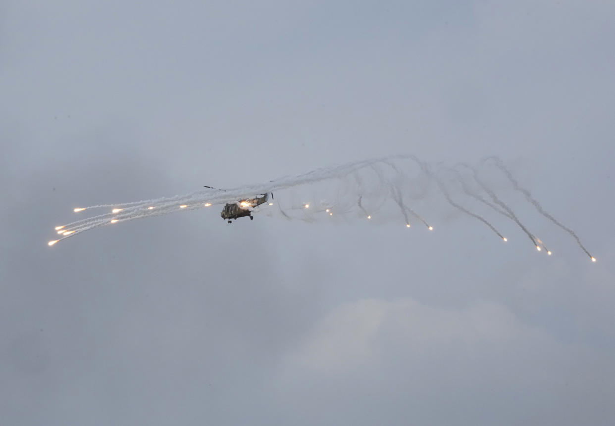The South Korean army's Surion helicopter fires flares during South Korea-U.S. joint military drills at Seungjin Fire Training Field in Pocheon, South Korea, Thursday, May 25, 2023. (AP Photo/Ahn Young-joon)