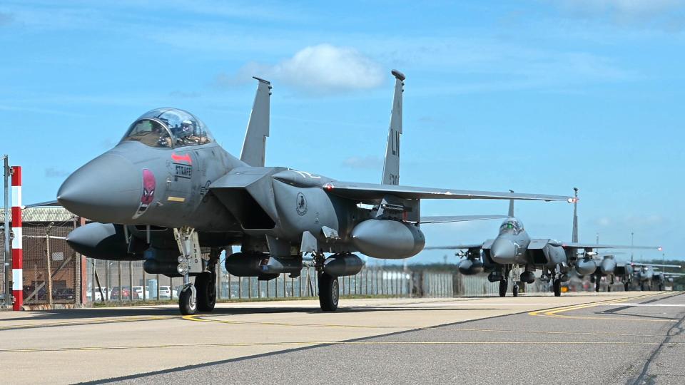 F-15E Strike Eagles assigned to the 494th Fighter Squadron return to RAF Lakenheath in the United Kingdom from a deployment to the Middle East on May 8, 2024. The jet in front has a particularly prominent kill marking painted on the nose in the form of a red missile silhouette. F-15Es from the 494th were among the aircraft that took part in the defense of Israel on April 13-14. <em>USAF</em>