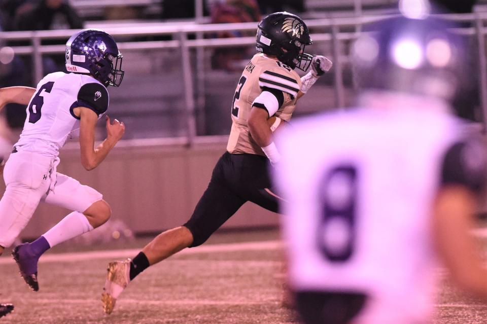 Quanah's Michael Garza (12) breaks away for a long touchdown run during Thursday's Region II-2A Division II bi-district playoff against Roscoe at Post on Nov. 11, 2021. The Indians had their season end with the 38-16 loss.