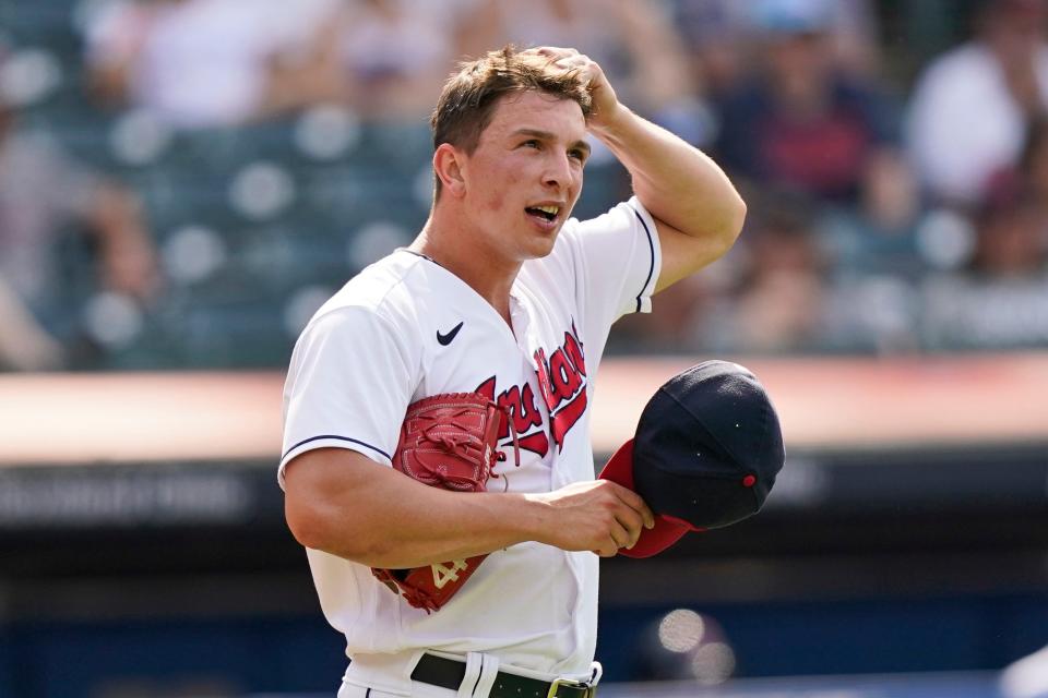 Cleveland Indians relief pitcher James Karinchak reacts after giving up a three-run home run to Minnesota Twins' Kyle Garlick in the tenth inning of a baseball game on May 23, 2021, in Cleveland. Karinchak underwent an MRI on Thursday, March 24, 2022, that revealed a "mild" strain in his right teres major muscle. (AP Photo/Tony Dejak, File)