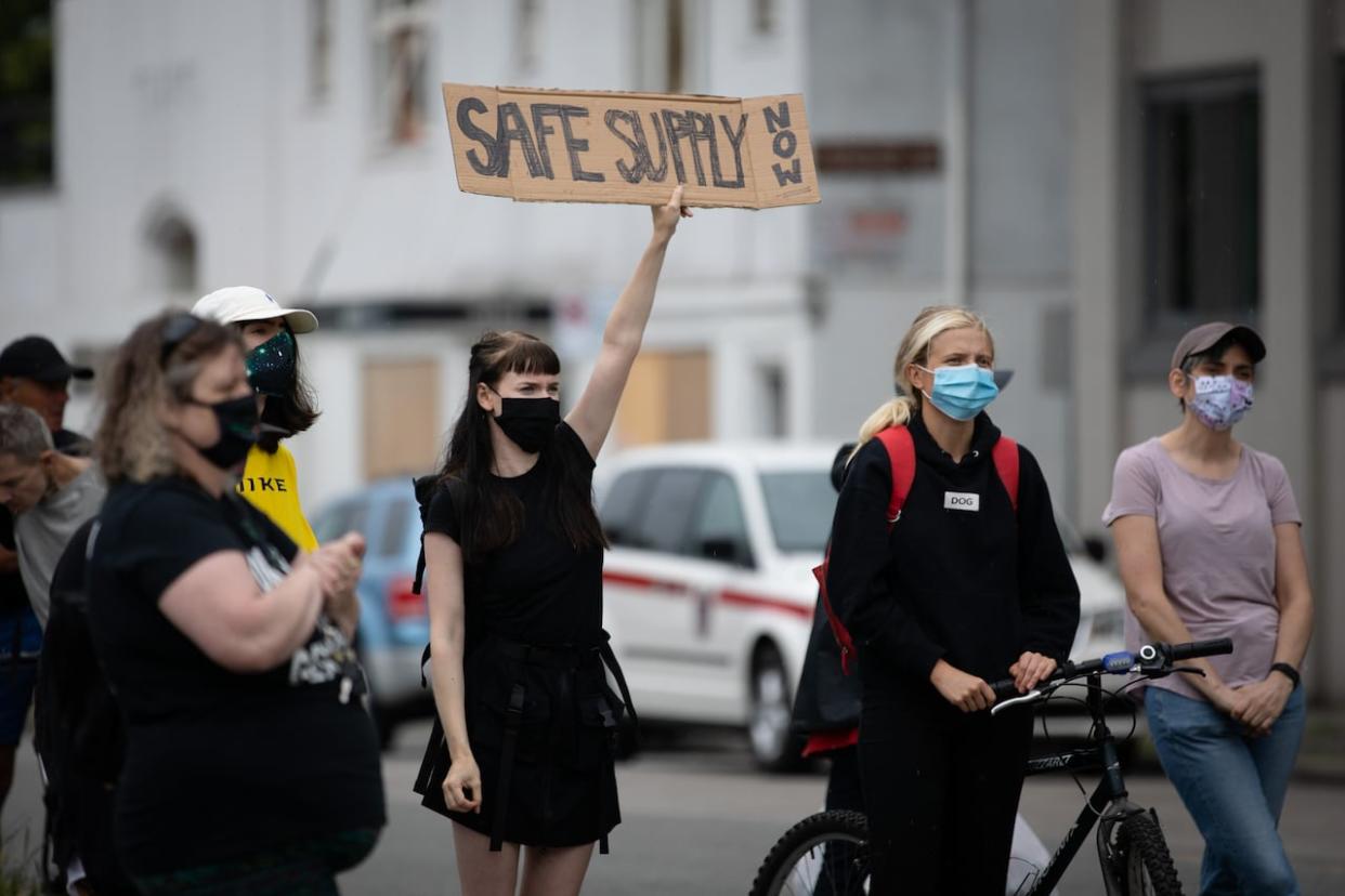 People gather at a Drug User Liberation Front rally in support of a safe supply of drugs in Vancouver in June 2020. In November this year, the B.C. NDP government banned illegal substance use in most public spaces. (Maggie MacPherson/CBC - image credit)