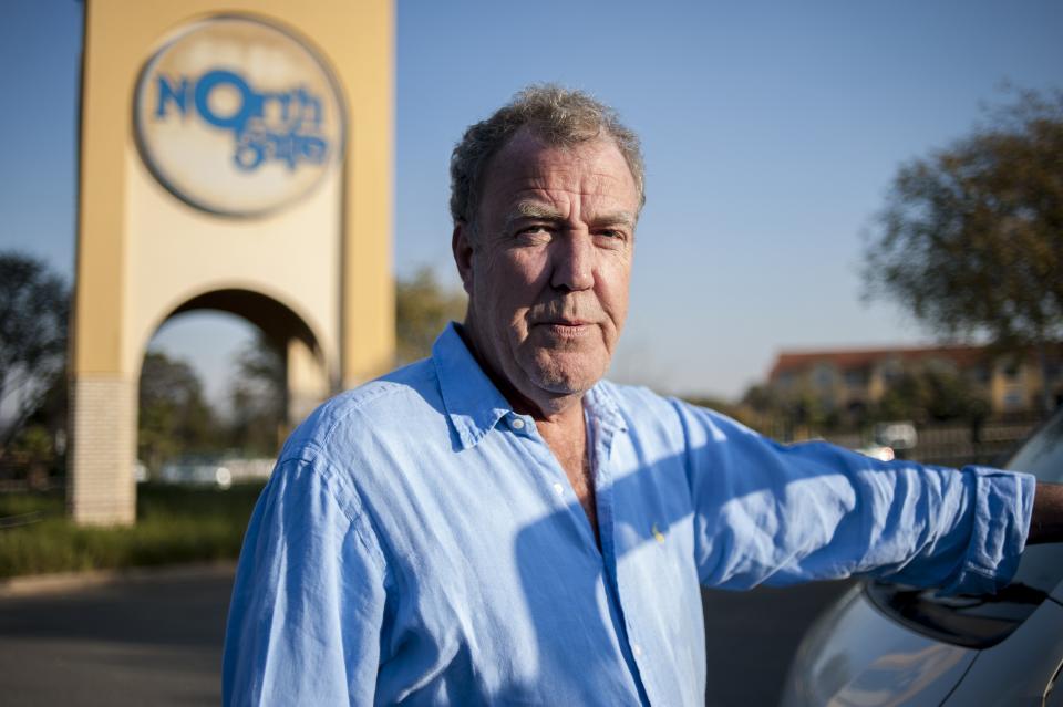 Former Top Gear presenter Jeremy Clarkson poses next to a South African taxi at the Ticketpro Dome before the Clarkson, Hammond and May Live Show held in Johannesburg on June 10, 2015. AFP PHOTO / STEFAN HEUNIS        (Photo credit should read STEFAN HEUNIS/AFP/Getty Images)