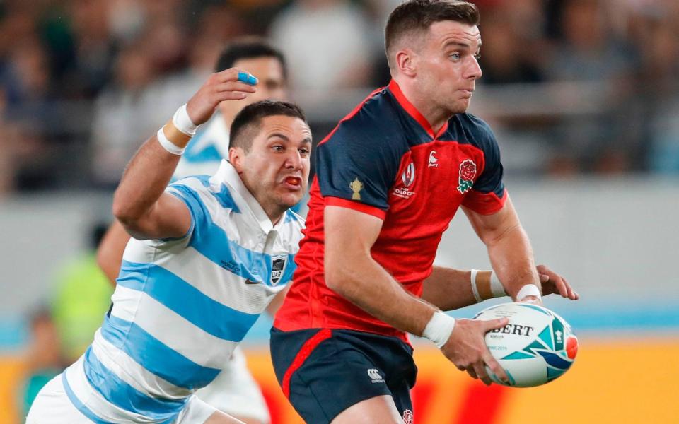 England fly-half George Ford (right) runs with the ball against Argentina - AFP